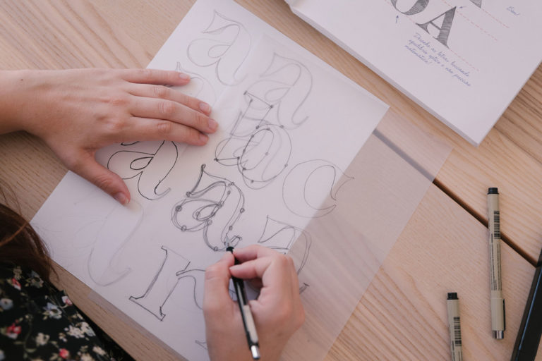 Brígida drawing letters from a custom font