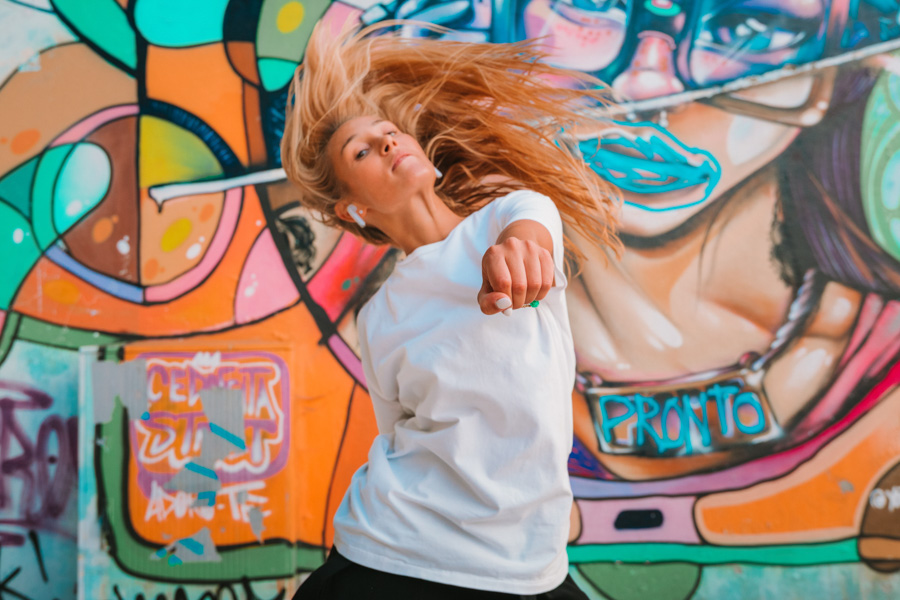 Irina dancing with street art as background