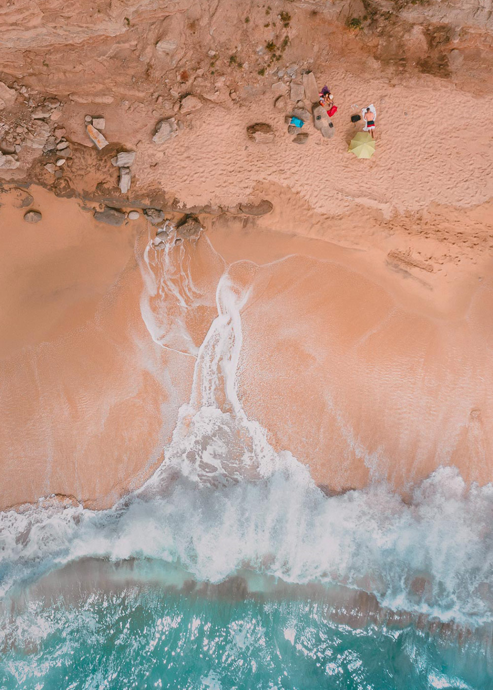 Aerial photography with sea and seashore with people, in Peniche, Portugal