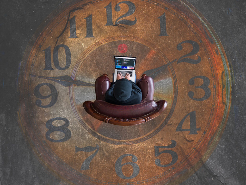 Deadlines: man working on his computer with clock as background