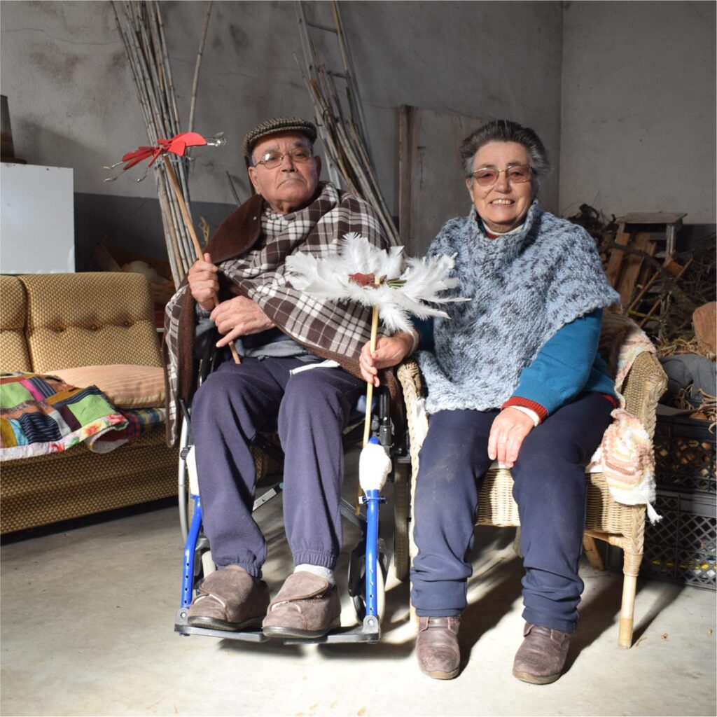 Elderly people contemplating an artwork within the Museum in the Village experience.