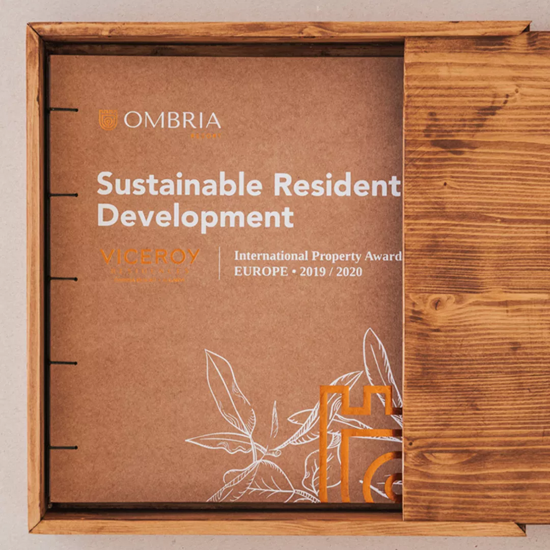 Ombria award plaque for Sustainable Resident Development inside a wooden frame