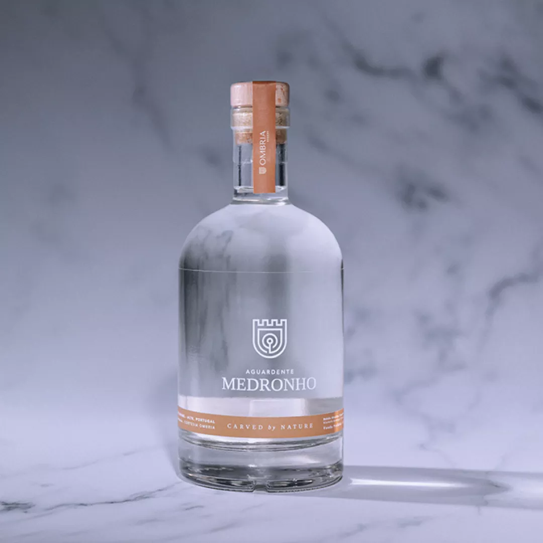 Bottle of Aguardente Medronho from Ombria with cork cap and minimalist label design