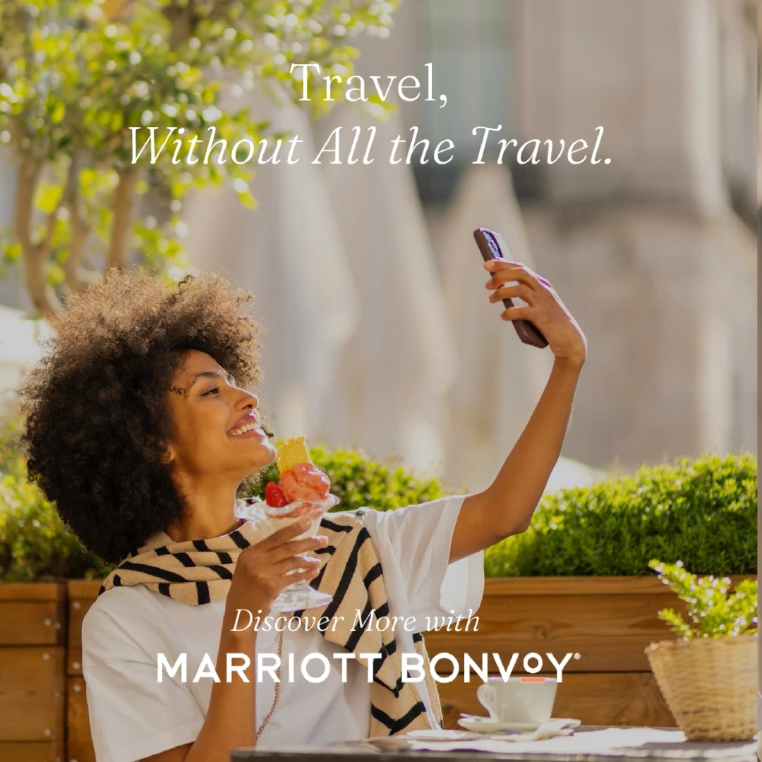 Woman enjoying ice cream and taking a selfie at an outdoor café with Marriott Bonvoy logo overlay